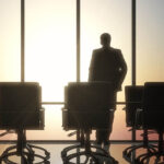Silhouette of lawyer in conference room.