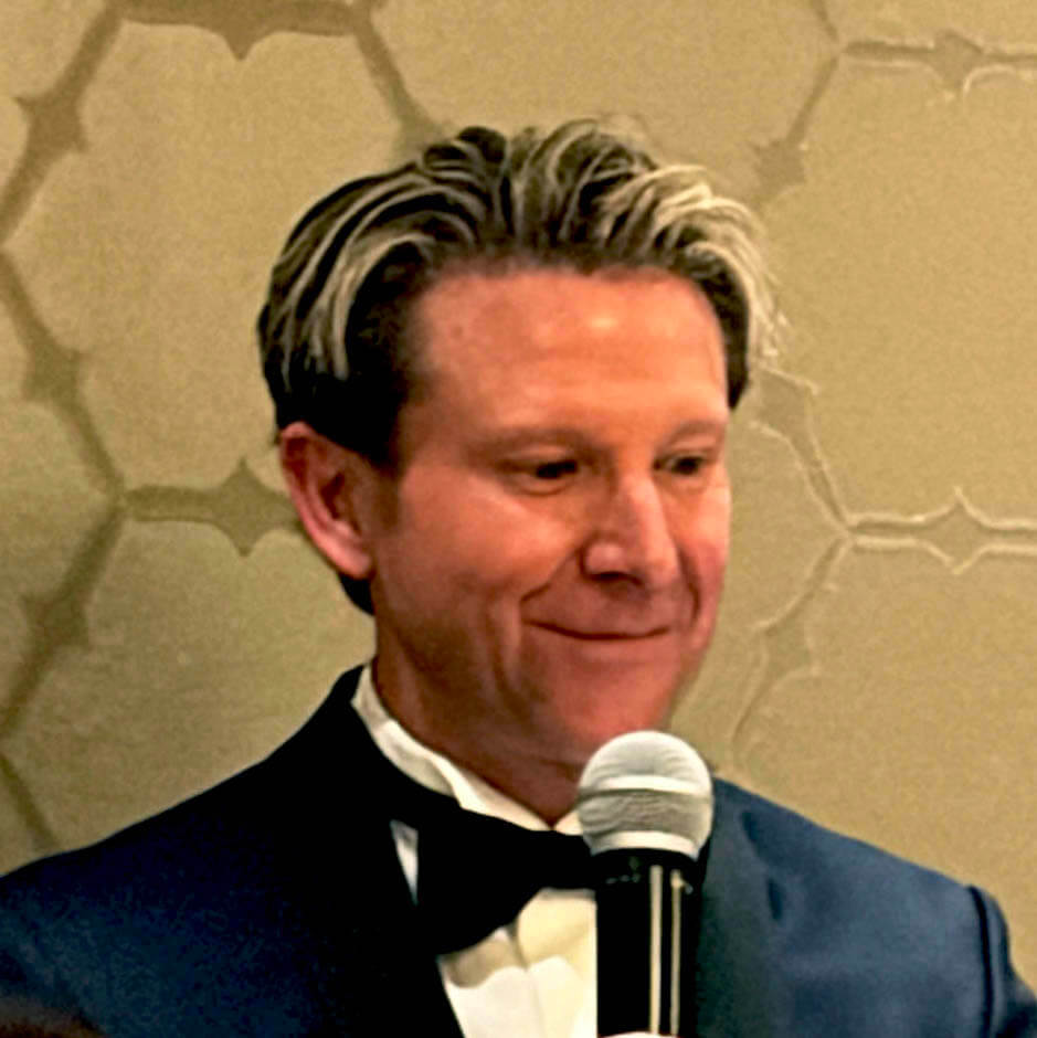 Attorney Eric Pollart accepting the PWc President's Award for 2026