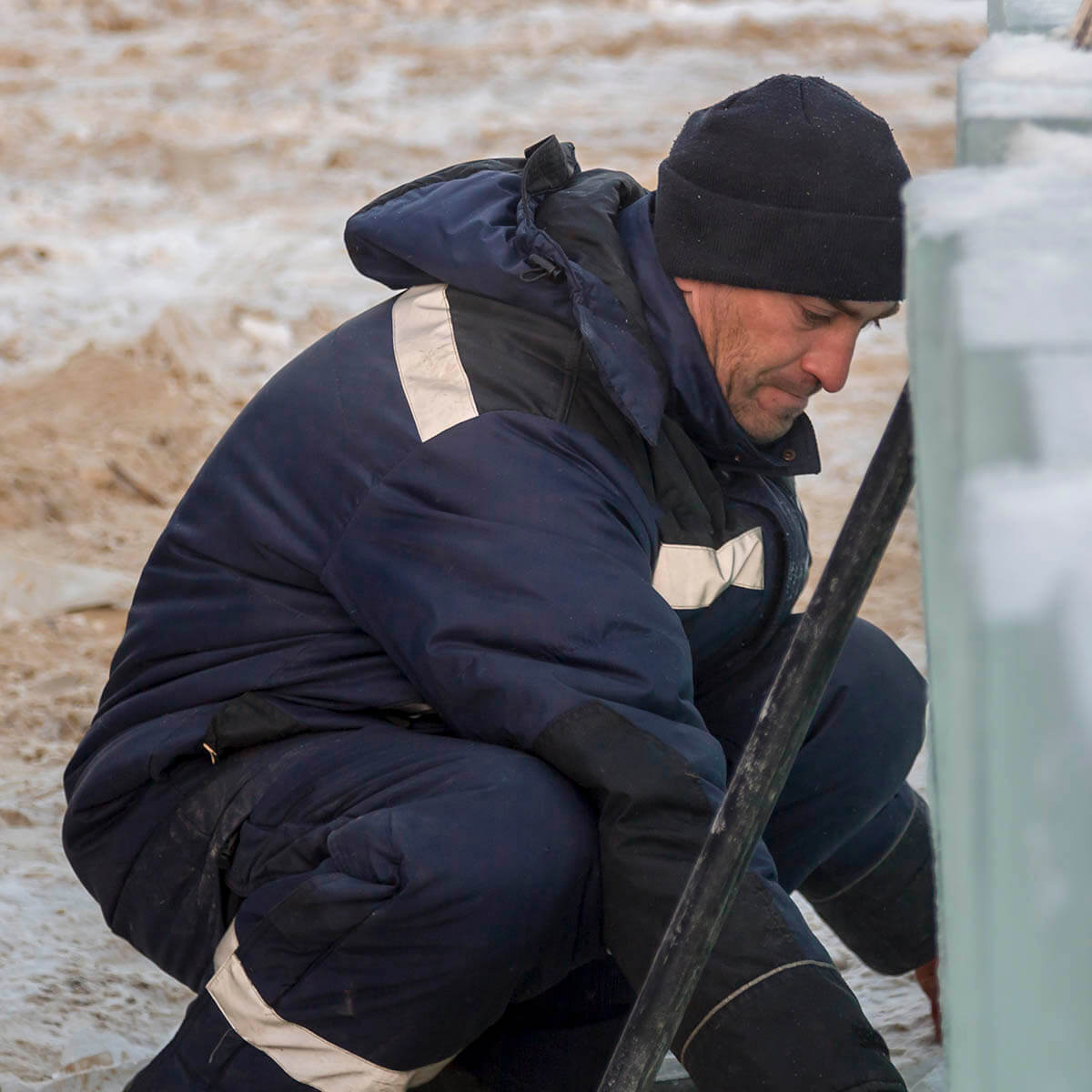 A CDL driver for a frac heating company alleges a workplace injury to his lower back while crouched down trying to lift frozen equipment