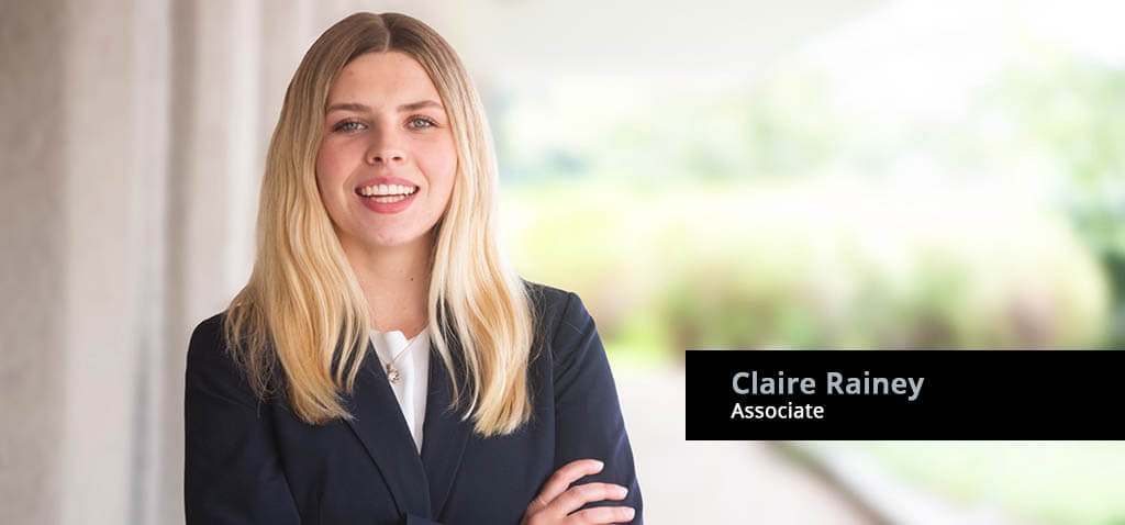 Banner with portrait of Attorney Claire Rainey